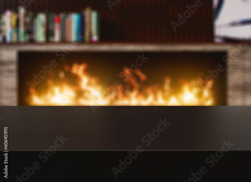 Black table surface with defocused background fireplace. Surface for display purposes 
