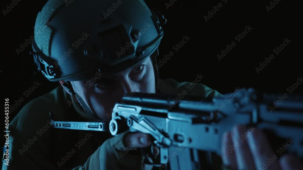 A Kalashnikov assault rifle in the hands of a Ukrainian soldier. The ...