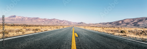 Panoramic view of an empty straight highway in desert