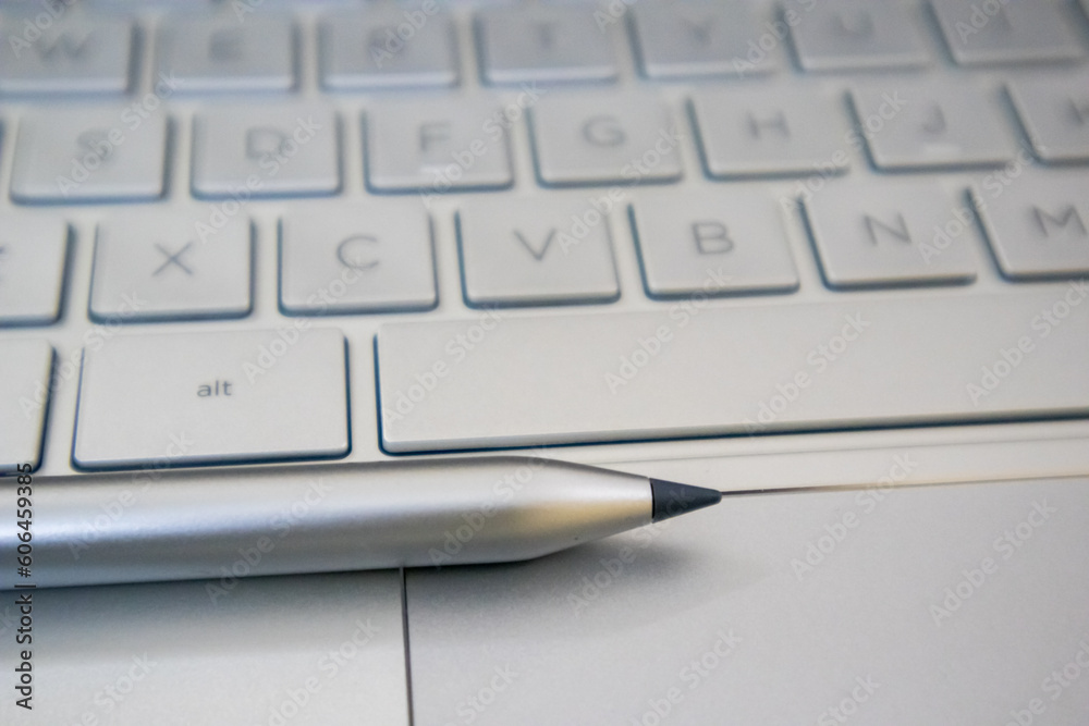 A touch pencil on the laptop. A touch pencil on the laptop.