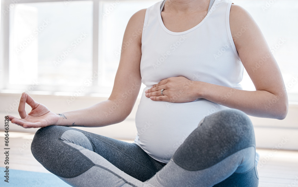 Woman, pregnancy yoga and lotus on floor for health, exercise and wellness for body, mind and peace. Girl, pregnant and pilates with zen meditation, mindfulness and relax in gym, studio or house