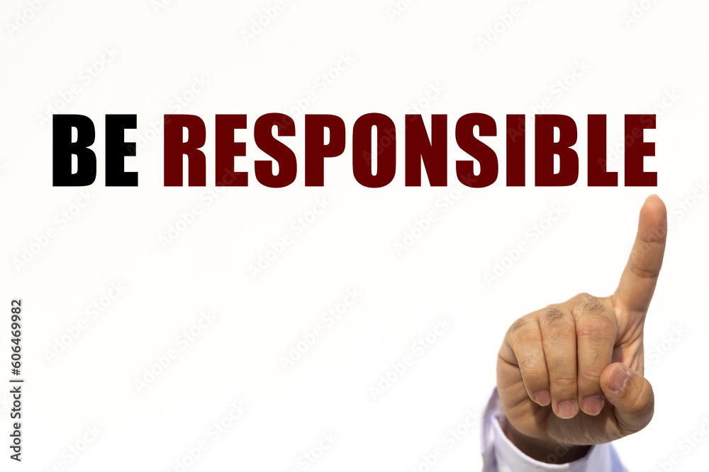 Be responsible text on white wall background with businessman's finger point at the message with empty space. This message can be used as business concept about be reponsible. Be responsible text on white wall background with businessman's finger point at the message with empty space. This message can be used as business concept about be reponsible.
