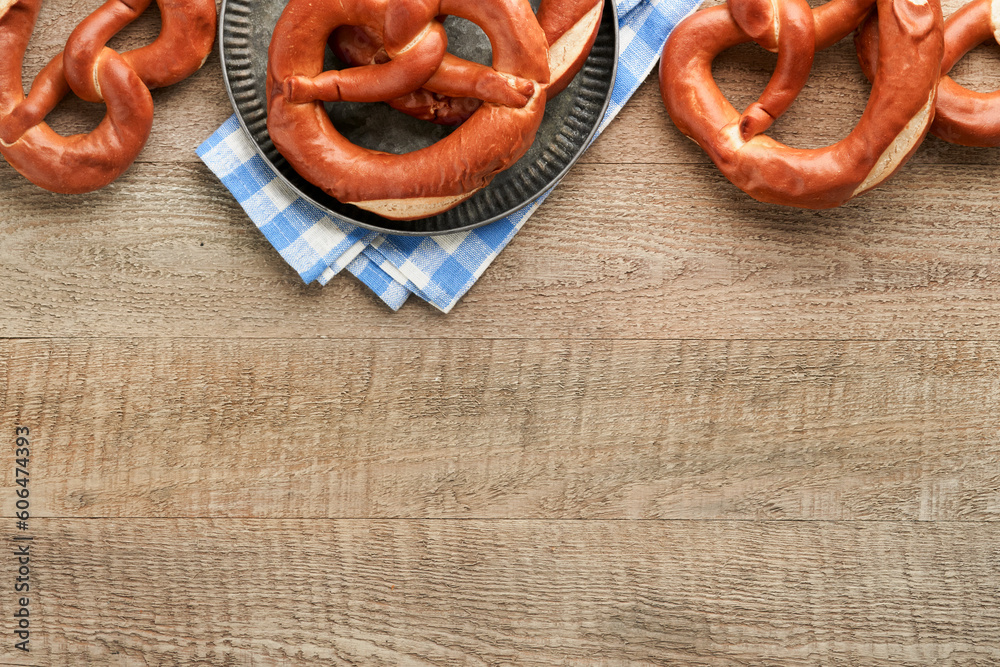 Oktoberfest concept card. Traditional Bavarian pretzels with beer bottle mug on old rustic wooden background. Perfect for Octoberfest. Oktoberfest food menu. Top view. Mock up. Oktoberfest concept card. Traditional Bavarian pretzels with beer bottle mug on old rustic wooden background. Perfect for Octoberfest. Oktoberfest food menu. Top view. Mock up.