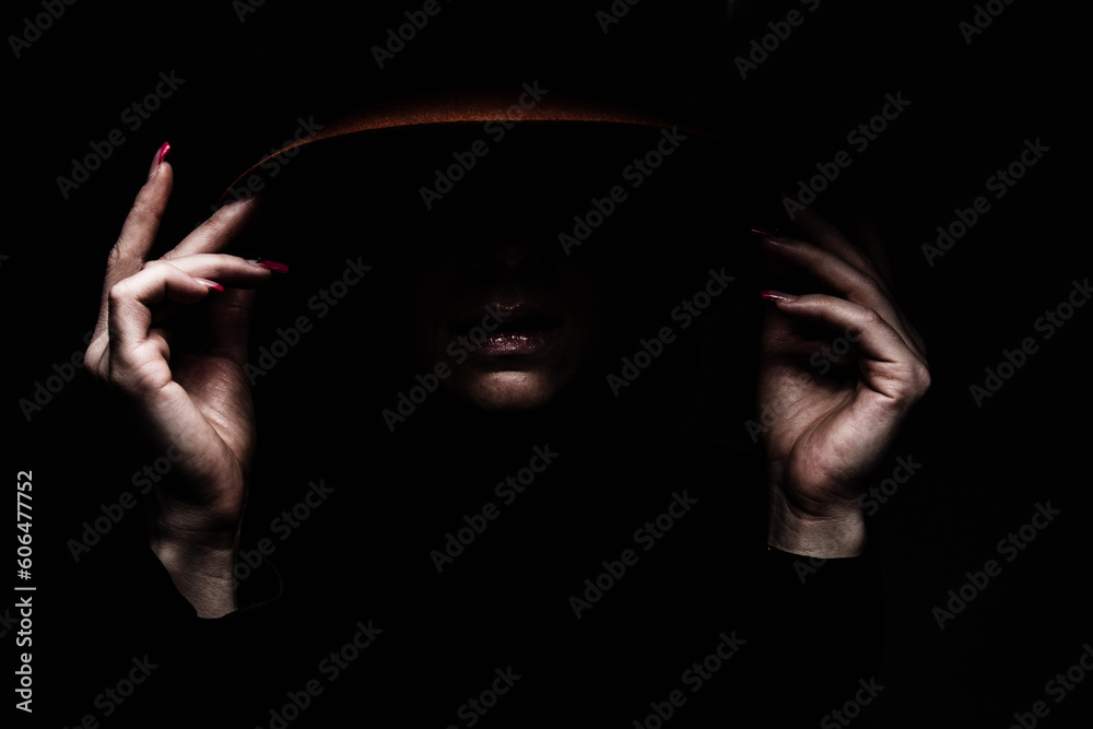 black background women hands edge hat