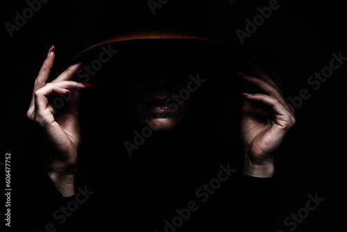 black background women hands edge hat