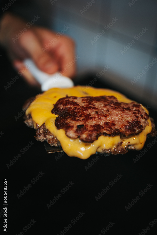 Meat burger with melted cheese