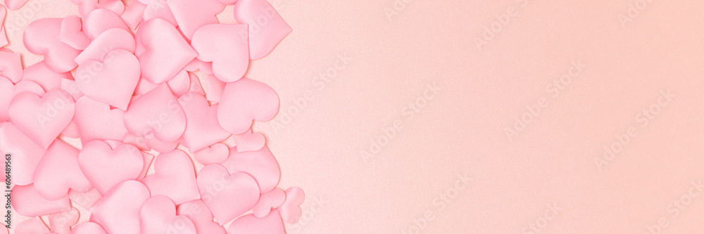Banner with fame made of textile hearts confetti on a pink background. Place for text.