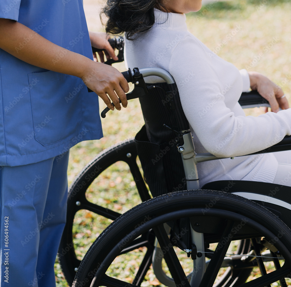young asian physical therapist working with senior woman on walking with a walker young asian physical therapist working with senior woman on walking with a walker