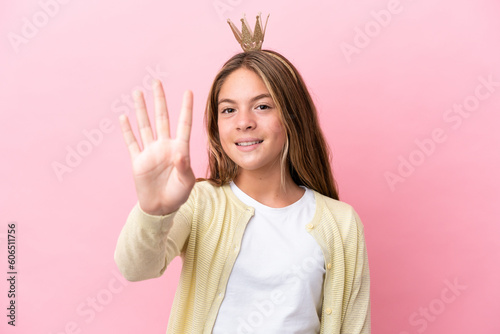 Little princess with crown isolated on pink background happy and counting four with fingers