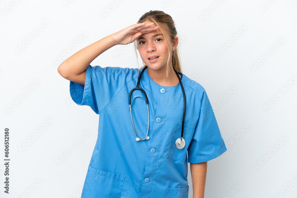 Little caucasian girl disguised as surgeon isolated on white background looking far away with hand to look something Little caucasian girl disguised as surgeon isolated on white background looking far away with hand to look something