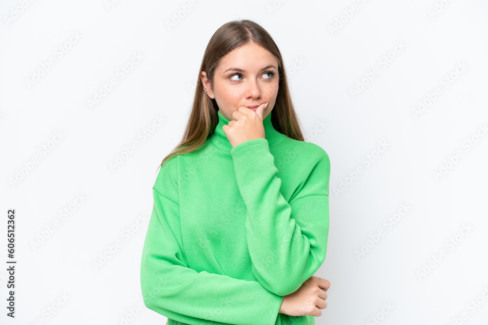 Young beautiful blonde woman isolated on white background thinking an idea while looking up Young beautiful blonde woman isolated on white background thinking an idea while looking up