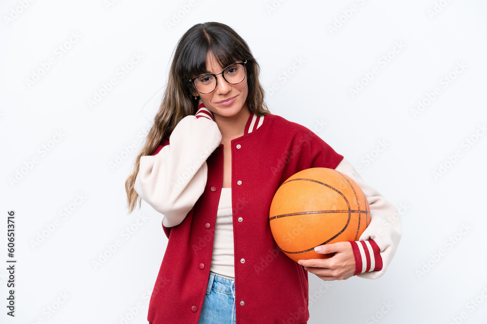 Young caucasian woman playing basketball isolated on white background laughing