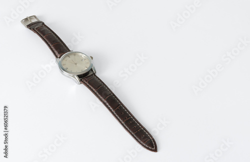 Wrist watch in the old style on a leather strap. Arranged diagonally on a white background isolated. place for text