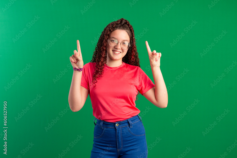 Teenager with red curly hair, wearing jeans, shirt, glasses and with various facial expressions of feelings Teenager with red curly hair, wearing jeans, shirt, glasses and with various facial expressions of feelings