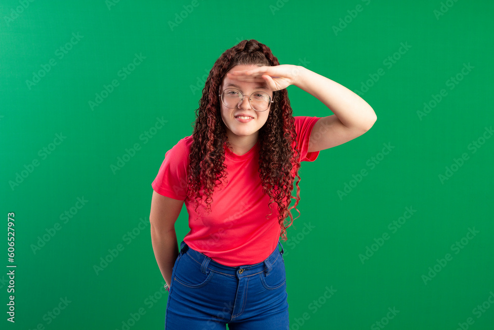 Teenager with red curly hair, wearing jeans, shirt, glasses and with various facial expressions of feelings Teenager with red curly hair, wearing jeans, shirt, glasses and with various facial expressions of feelings