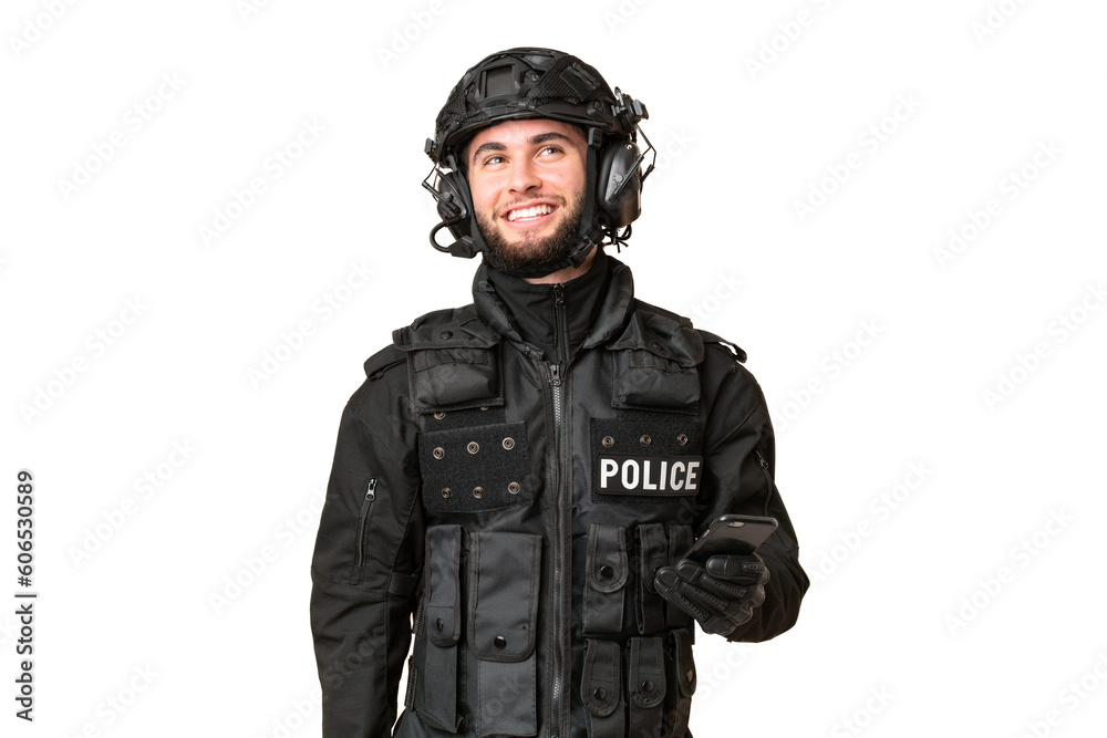 SWAT over isolated chroma key background keeping a conversation with the mobile phone SWAT over isolated chroma key background keeping a conversation with the mobile phone