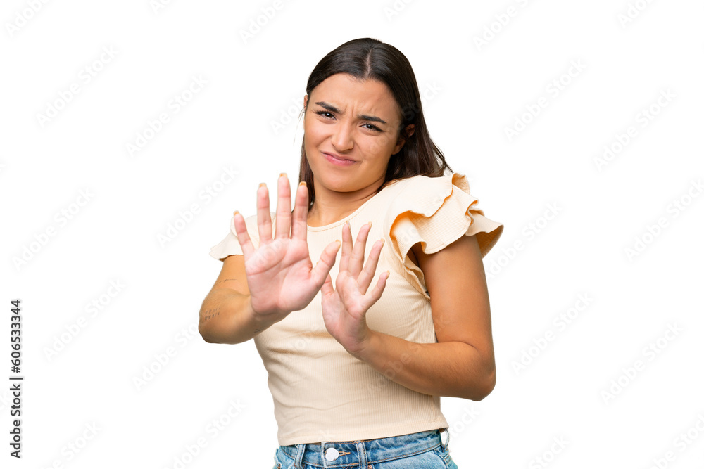 Young caucasian woman isolated on green chroma background nervous stretching hands to the front Young caucasian woman isolated on green chroma background nervous stretching hands to the front