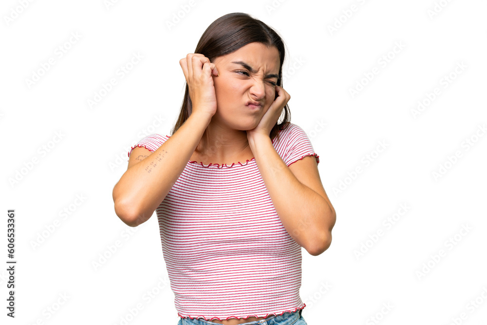 Young caucasian woman isolated on green chroma background frustrated and covering ears Young caucasian woman isolated on green chroma background frustrated and covering ears