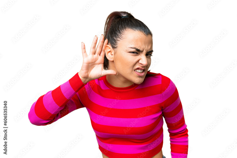 Young beauty woman over isolated chroma key background listening to something by putting hand on the ear Young beauty woman over isolated chroma key background listening to something by putting hand on the ear