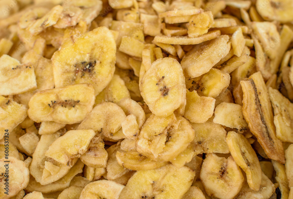 Image of dehydrated banana strips stocked in market for consumption.