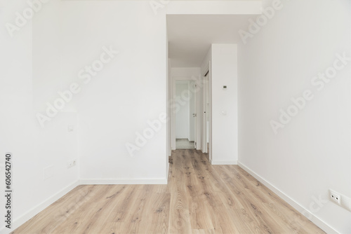 An empty bedroom with an en-suite bathroom