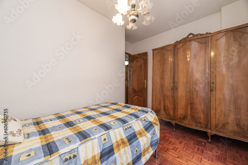 A double bedroom with an anachronistic wooden wardrobe photo