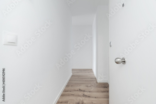 Hall of a recently built house with a white armored door