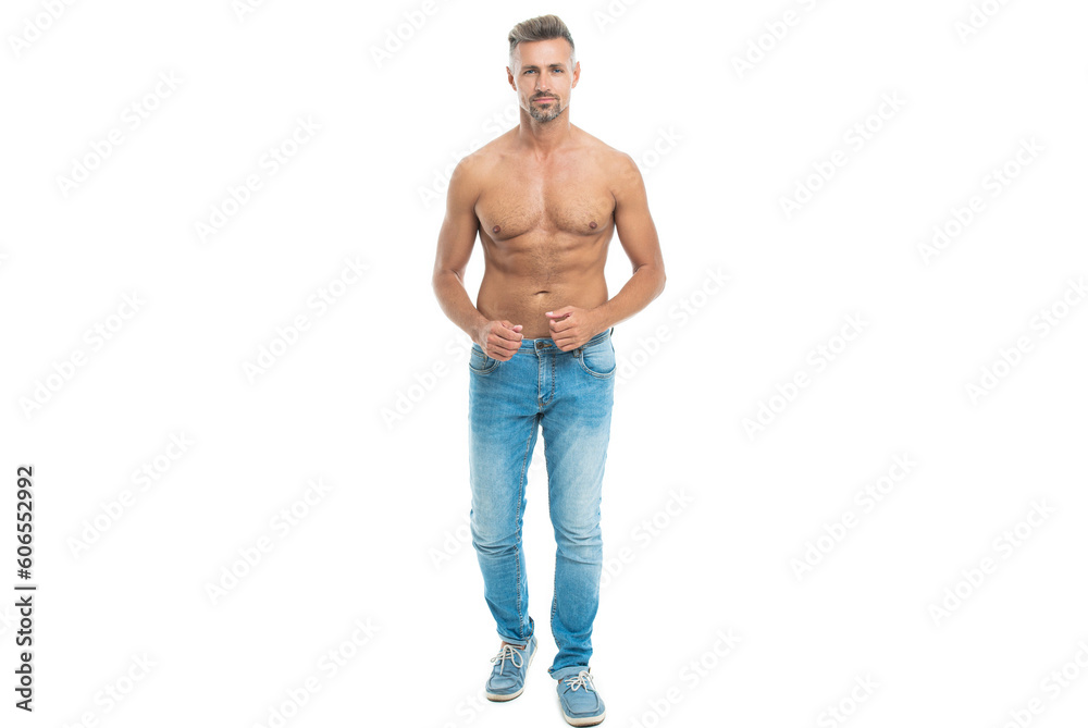 Fototapeta premium fit and muscular man shows shirtless abs and torso body physique in studio