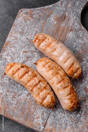 Delicious grilled sausages from chicken or pork meat with salt, spices and herbs