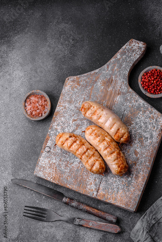 Delicious grilled sausages from chicken or pork meat with salt, spices and herbs
