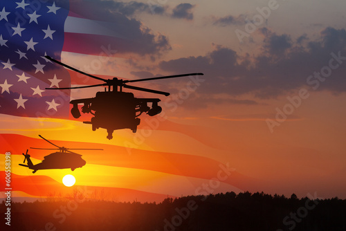 Silhouettes of helicopters on background of sunset with a transparent American flag.