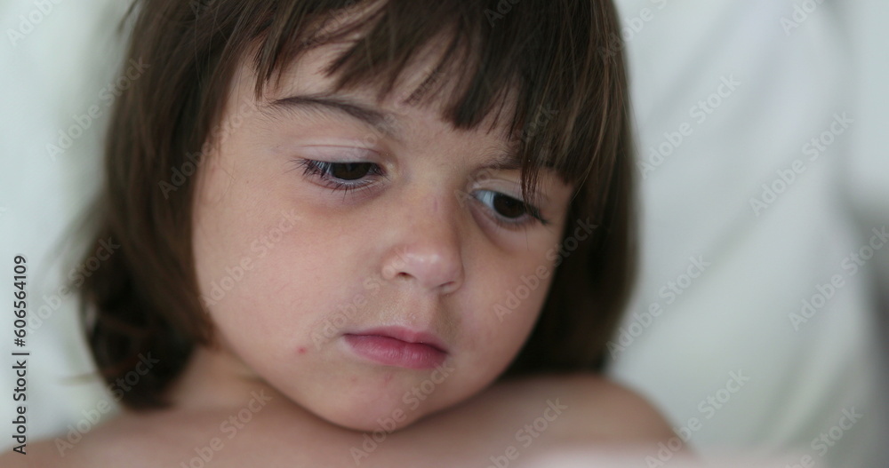 Close-up of little girl child absorbed by content online on cellphone Close-up of little girl child absorbed by content online on cellphone