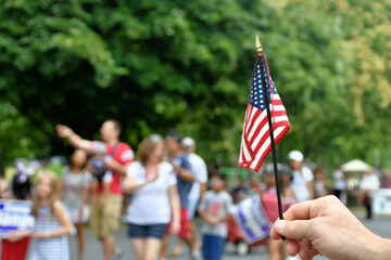 Waving an American flag at the Independence Day Parade on the 4th of July 