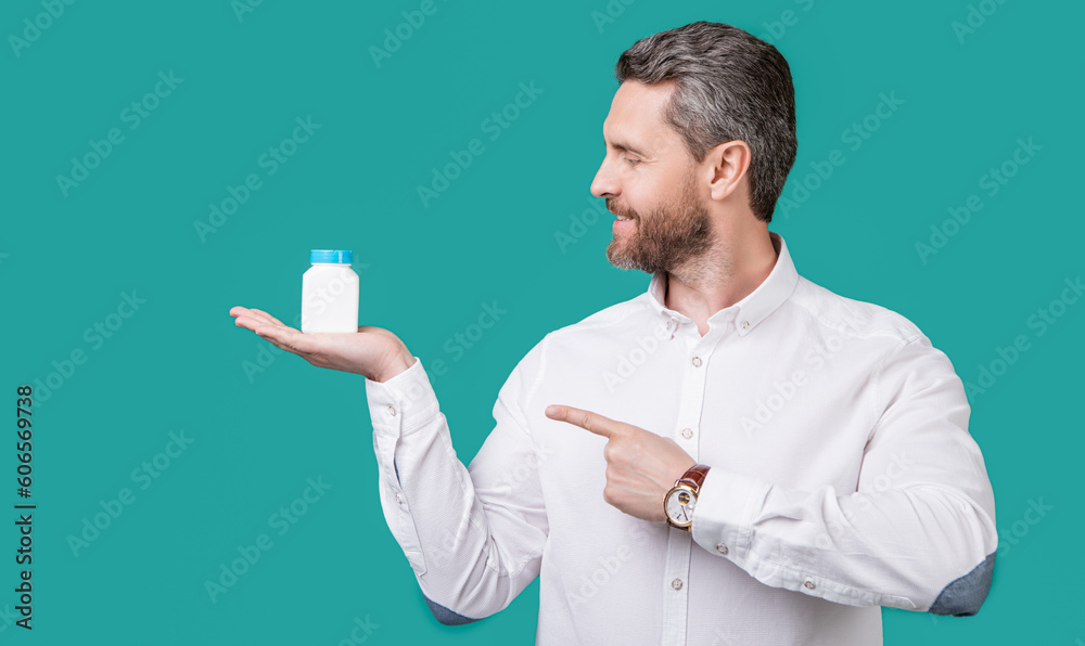 man point finger on medication jar. photo of man holding medication, healthcare. man point finger on medication jar. photo of man holding medication, healthcare.