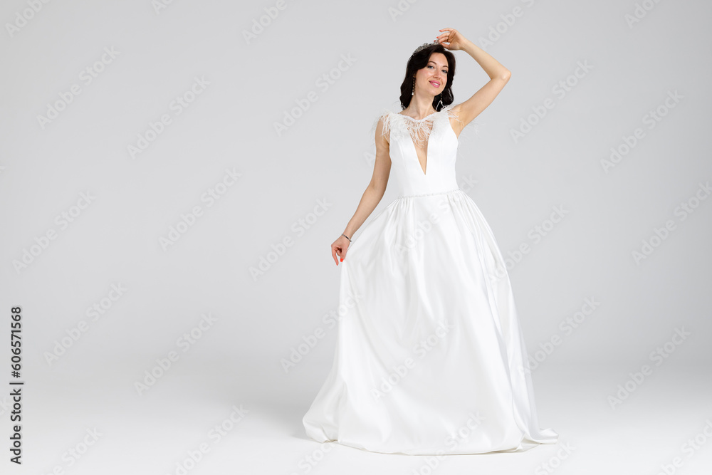 Beautiful bride in elegant white dress. isolated on white background. full length