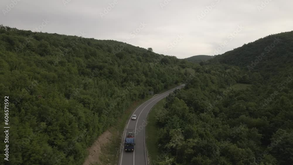 aerial view drone view on automobile on the road trough the trees in mountain range in spring day - Tresibaba Knjazevac in Serbia - Travel journey and vacation concept car driving aerial view drone view on automobile on the road trough the trees in mountain range in spring day - Tresibaba Knjazevac in Serbia - Travel journey and vacation concept car driving