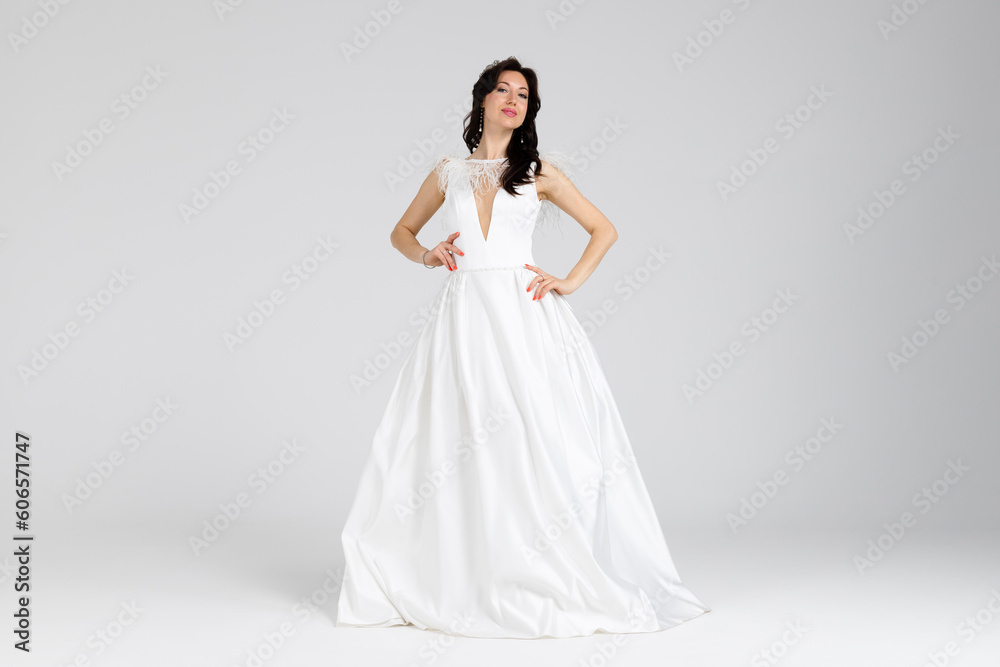 Beautiful bride in elegant white dress. isolated on white background. full length