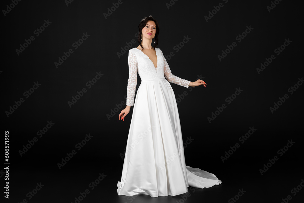 Beautiful bride in elegant exquisit white dress. isolated on black background. Beautiful bride in elegant exquisit white dress. isolated on black background.