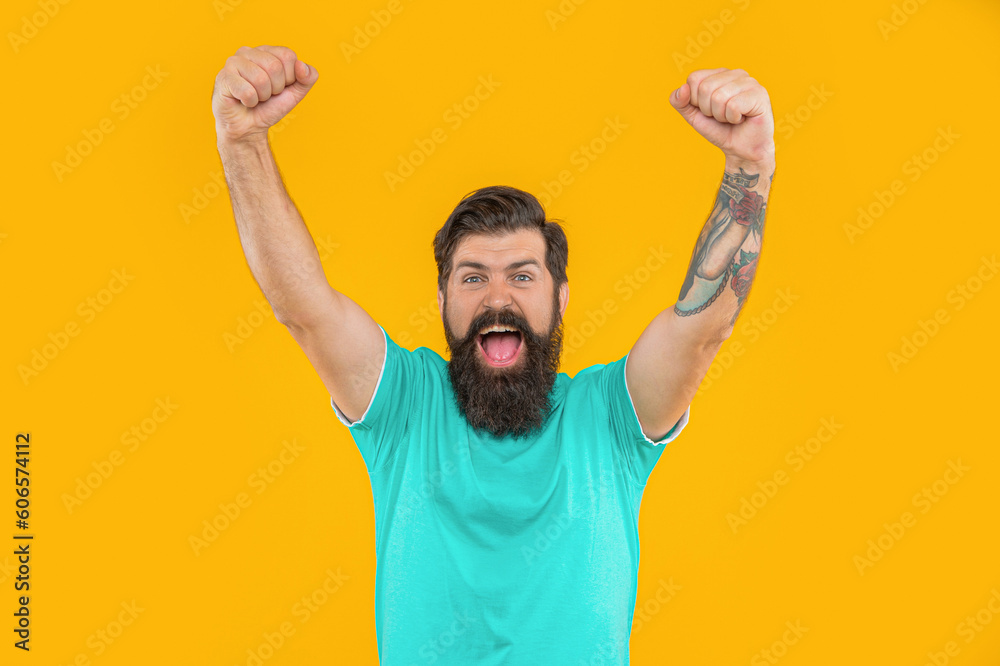 Fototapeta premium portrait of successful brutal man with beard isolated on yellow. portrait of brutal man