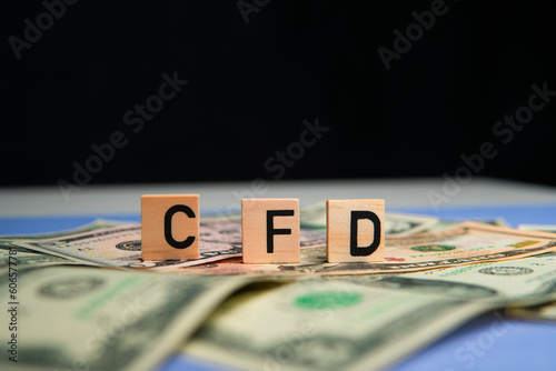 inscription cfd next to american dollars. CFD is Contract for Difference. Investing in contracts photo