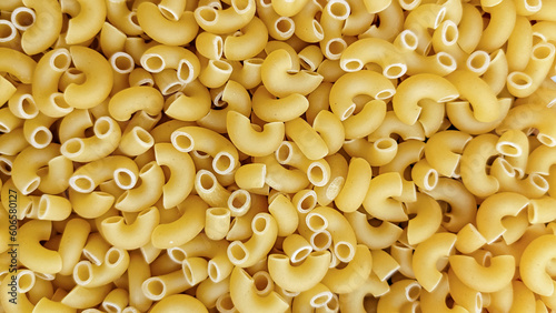 uncooked raw spaghetti macaroni delectable World of Pasta, seamless Italian food texture. pasta has been a staple in kitchens around the world