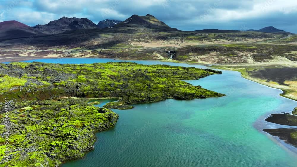 Lava fields covered with green moss in Iceland. Scenic national park area. Green volcanic field at summer. Epic unusual abstract landscape aerial view 4k.