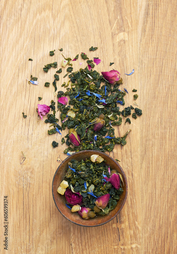 Tea in a wooden bowl on a wood