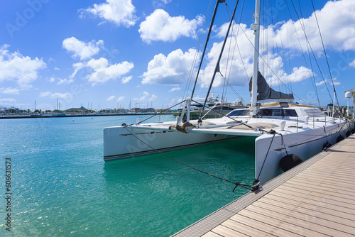 Saint Martin, Marigot waterfront Fort Louis marina with yachts and water sport activity.