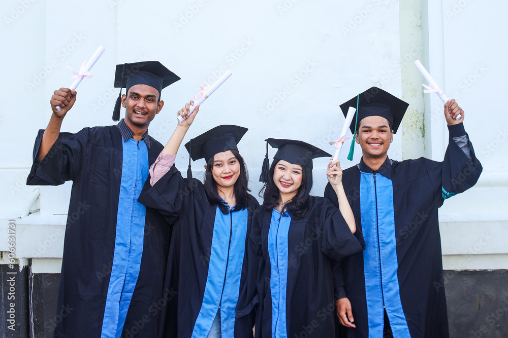 Portrait of students with success, education award and achievement in college. Group of people in celebration for certificate, diploma and academic degree