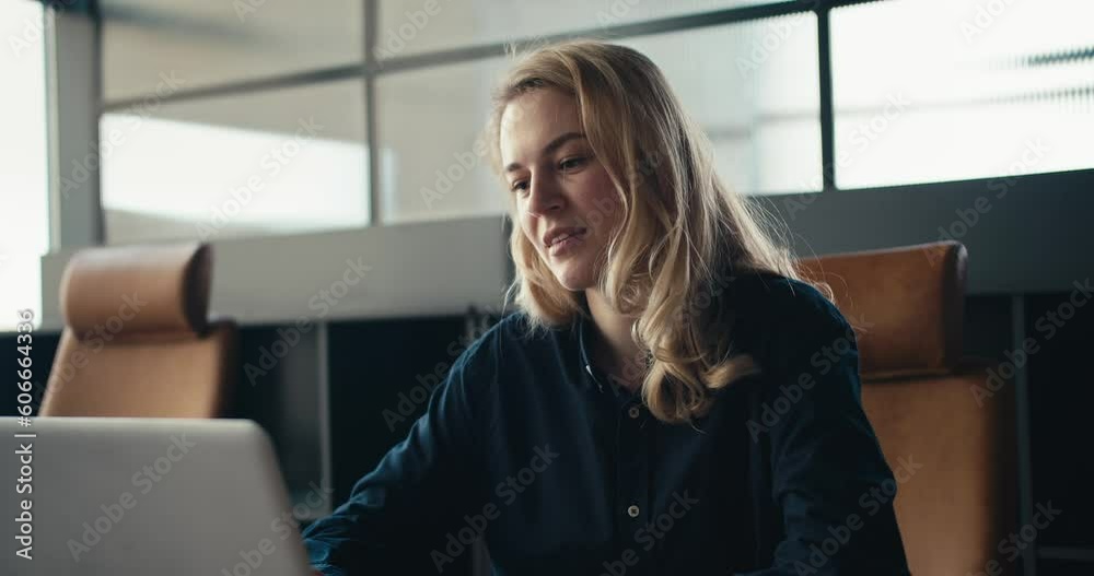 Productive Office Work: Blonde Woman Adjusting Hair While Using Laptop Productive Office Work: Blonde Woman Adjusting Hair While Using Laptop