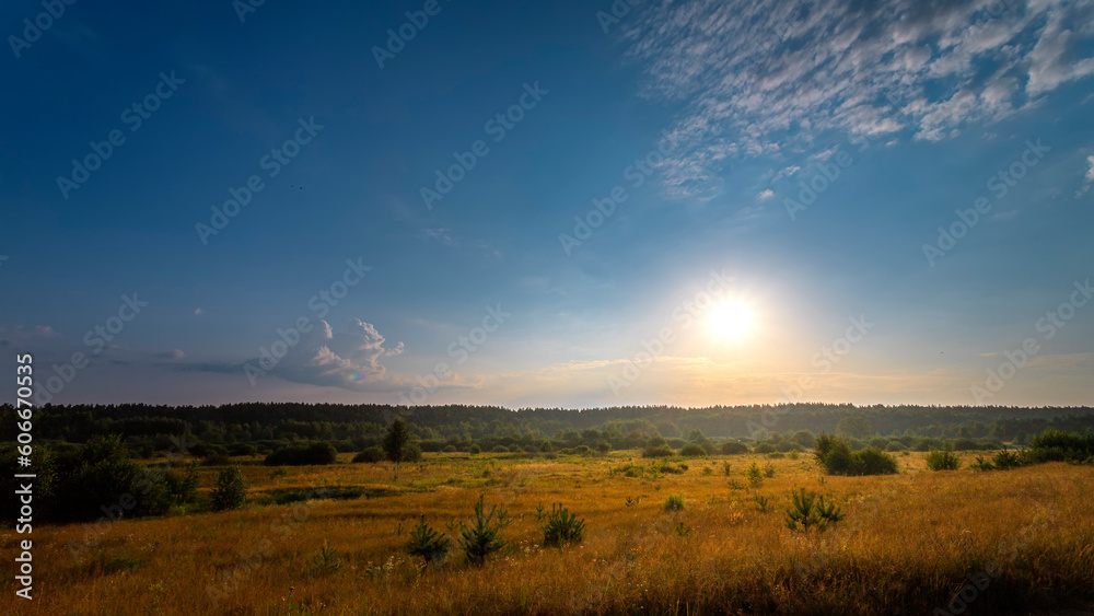 Natural summer sunrise. Beautiful sky. Countryside landscape. Under scenic colorful sky at sunrise.