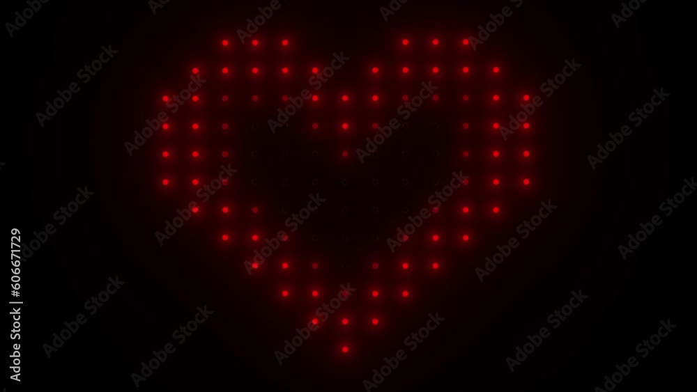 Heart made of red light bulbs on black background.