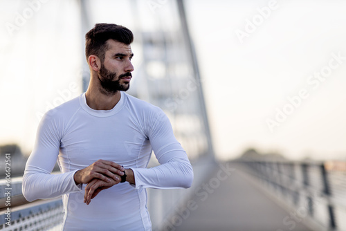 Athletic man stretch and exercise on the  brigde photo