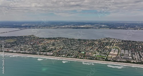 Melbourne Florida Aerial v10 panoramic panning view, drone flyover Atlantic Ocean overlooking at coastal neighborhoods, Paradise Beach, Indian river and airport - Shot with Mavic 3 Cine - March 2022 photo